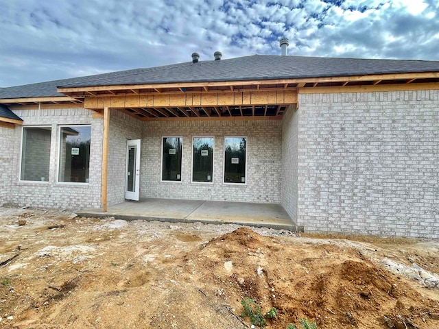 rear view of property featuring a patio