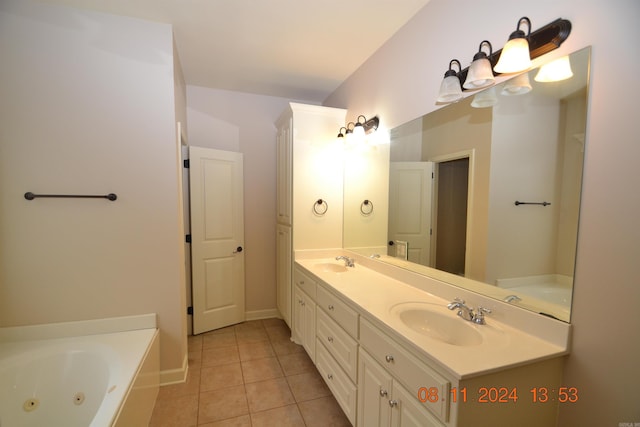 bathroom with vanity, a tub to relax in, and tile patterned floors