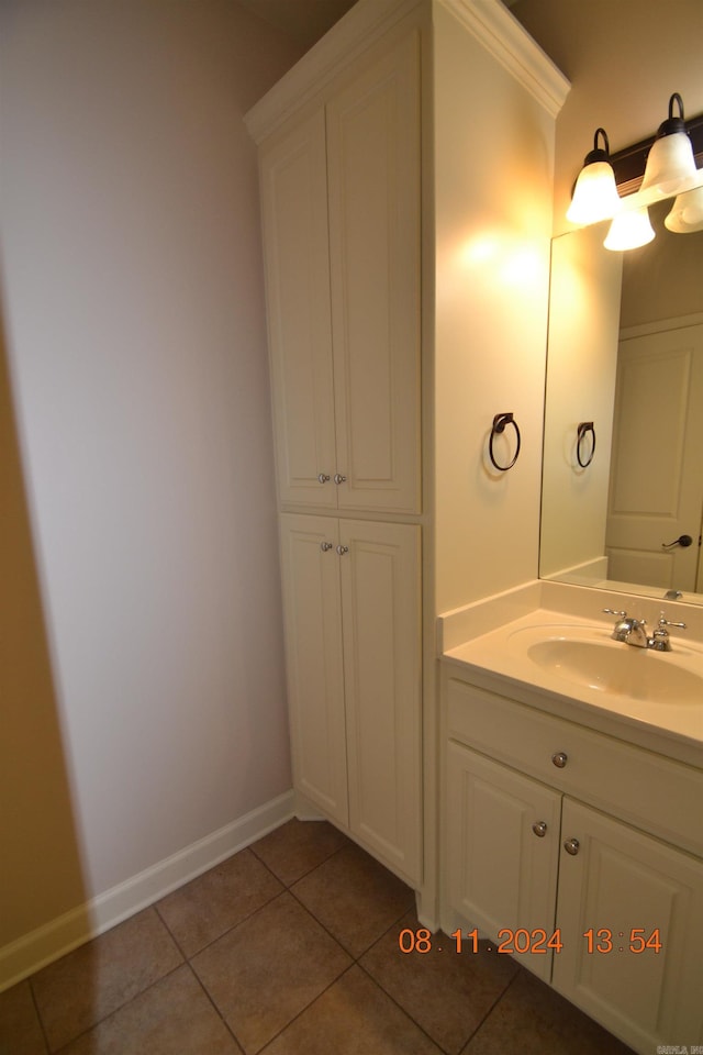 bathroom with tile patterned flooring and vanity