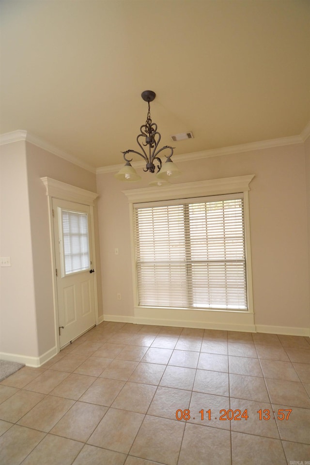 interior space featuring plenty of natural light, light tile patterned floors, and ornamental molding