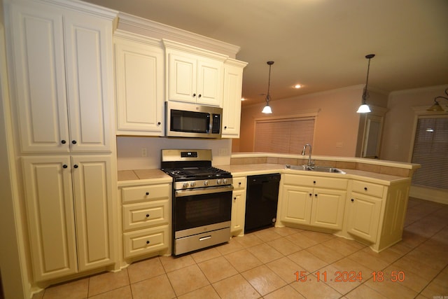 kitchen featuring appliances with stainless steel finishes, decorative light fixtures, light tile patterned floors, and sink