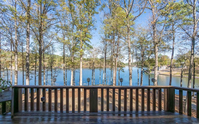 wooden deck with a water view