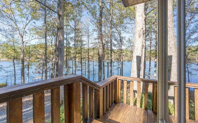 wooden deck featuring a water view