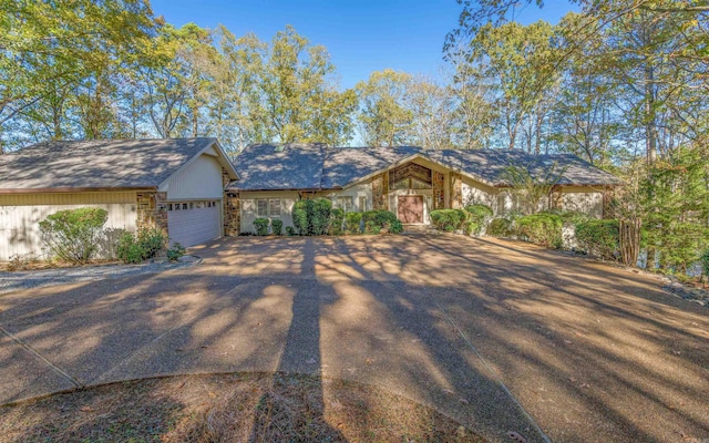 single story home featuring a garage