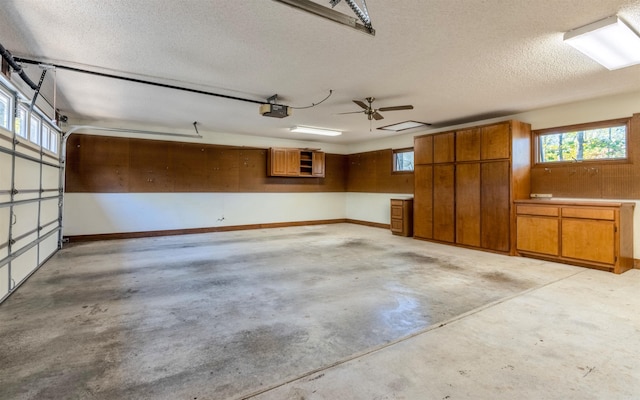 garage featuring a garage door opener and ceiling fan