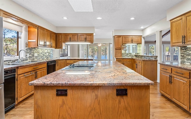 kitchen with a kitchen island and a healthy amount of sunlight