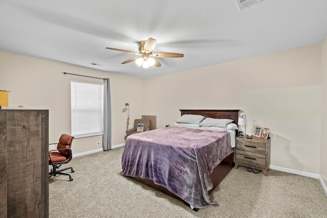 bedroom with ceiling fan and light carpet