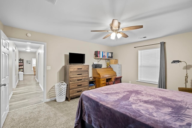 bedroom featuring ceiling fan and light hardwood / wood-style floors