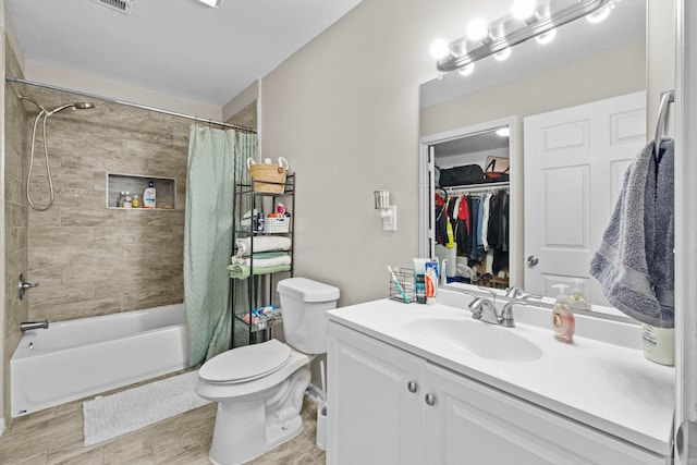 full bathroom featuring vanity, shower / bath combo, and toilet