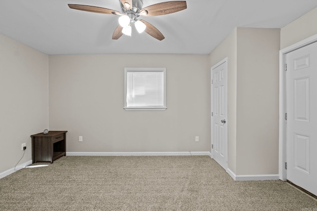 unfurnished room featuring ceiling fan and light colored carpet