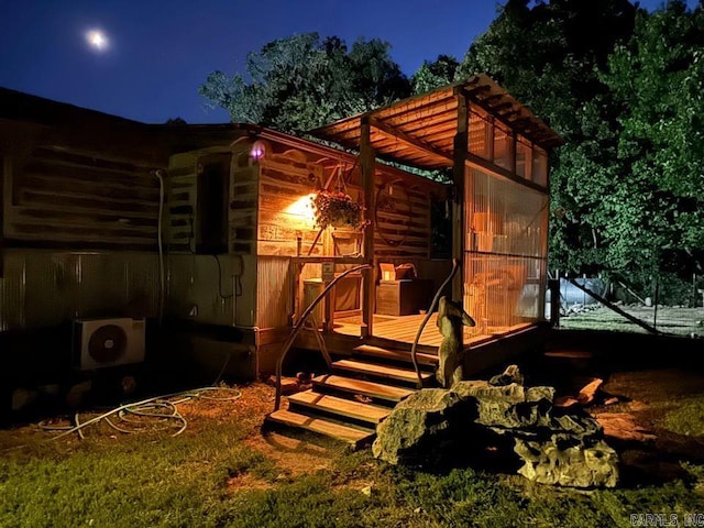 exterior space featuring ac unit and a deck