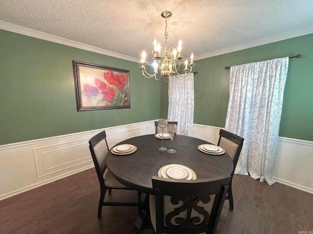 dining area featuring crown molding, dark hardwood / wood-style flooring, and a textured ceiling