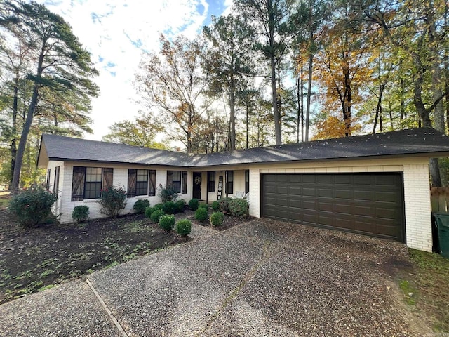 single story home featuring a garage