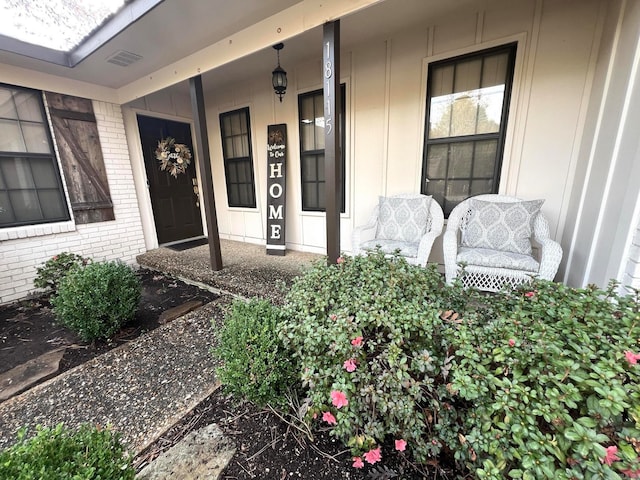 doorway to property featuring a porch