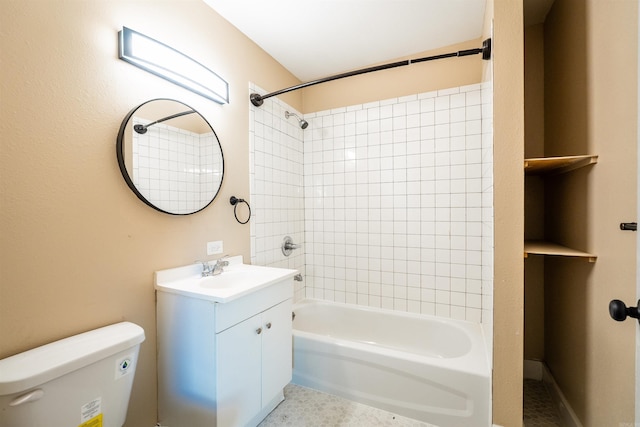 full bathroom featuring vanity, toilet, and tiled shower / bath