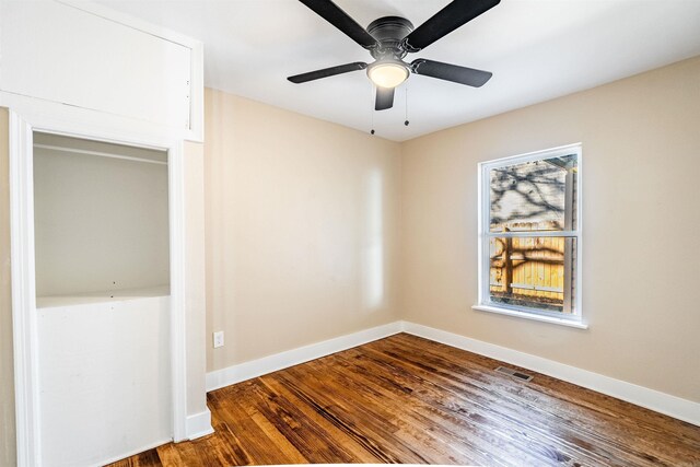 spare room with ceiling fan and hardwood / wood-style floors