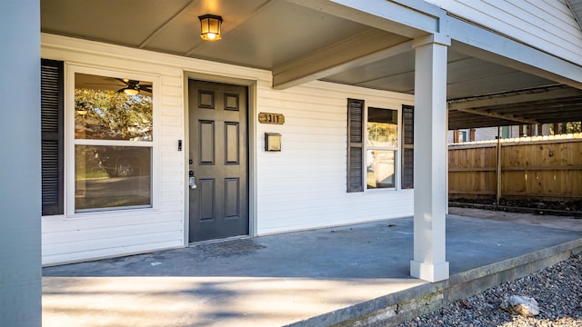 view of exterior entry featuring a patio