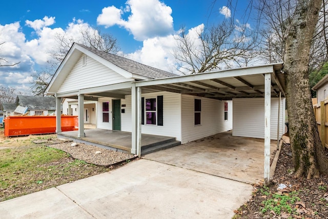 view of front facade featuring a carport and covered porch