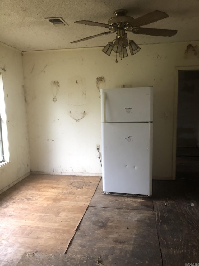 interior space featuring hardwood / wood-style floors, white refrigerator, and ceiling fan