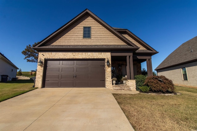 view of front of property featuring a front lawn and a garage