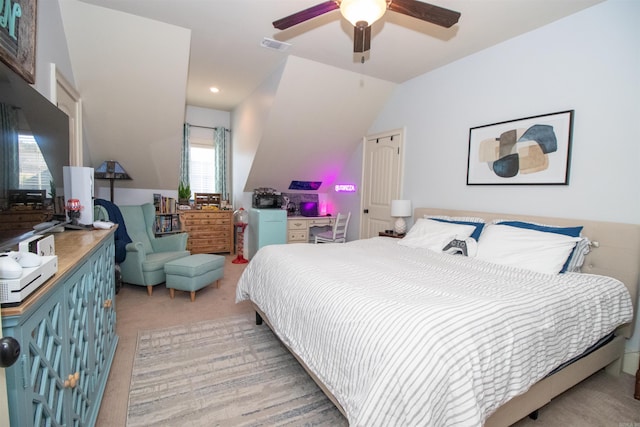 bedroom featuring light carpet, ceiling fan, and lofted ceiling