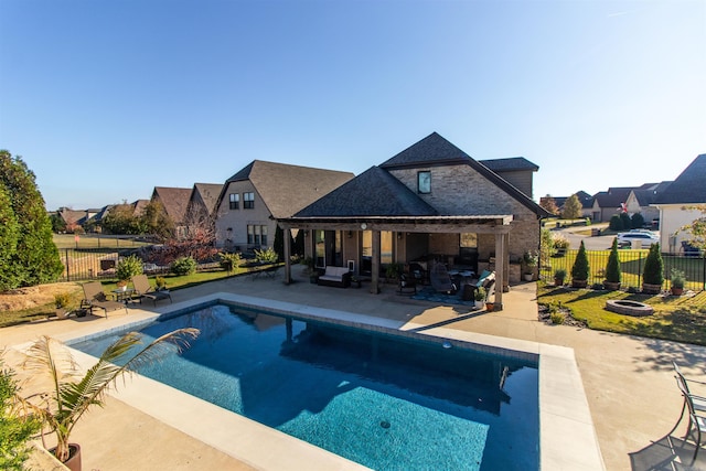 view of swimming pool with outdoor lounge area and a patio area