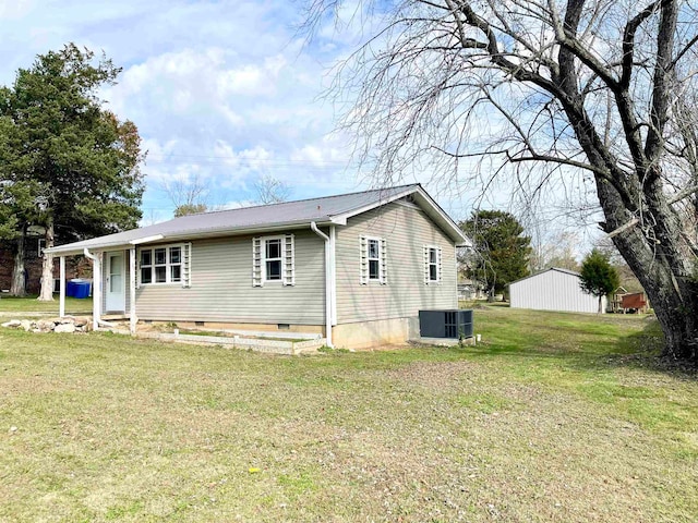 exterior space featuring a yard and central AC unit