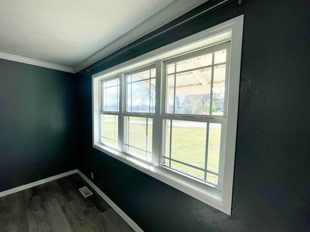 interior space featuring crown molding and hardwood / wood-style flooring