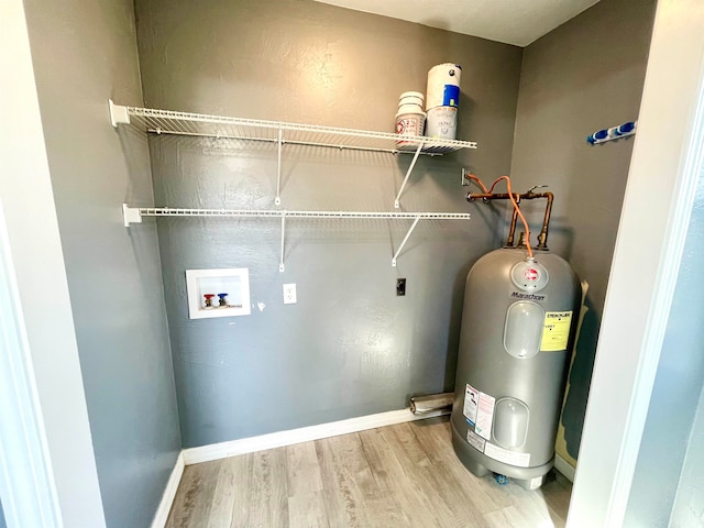 utility room featuring electric water heater