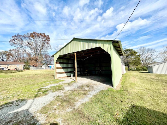 view of outdoor structure featuring a lawn