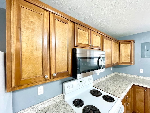 kitchen with lofted ceiling, electric panel, light stone counters, a textured ceiling, and electric stove