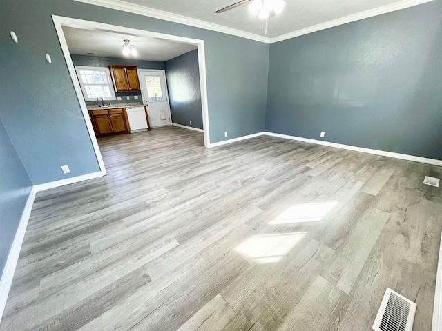 unfurnished living room featuring ornamental molding, sink, ceiling fan, and light hardwood / wood-style flooring