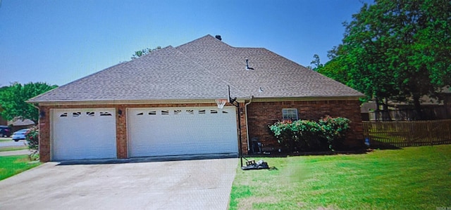 view of side of home with a yard