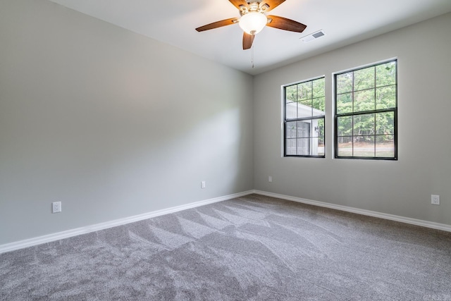 spare room with ceiling fan and carpet floors