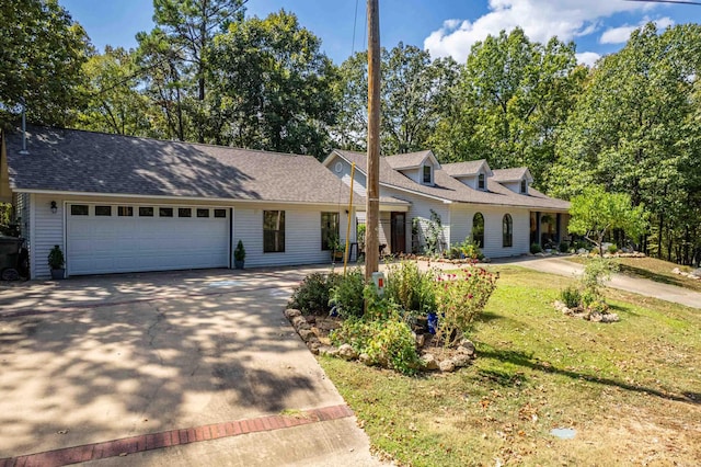 view of front facade with a front lawn and a garage