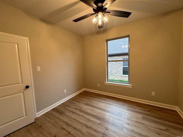 empty room featuring ceiling fan and wood-type flooring