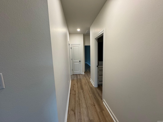 hallway featuring light hardwood / wood-style flooring