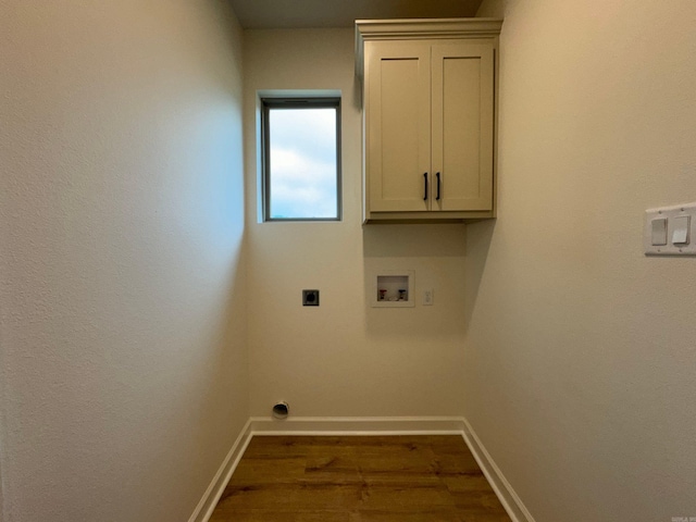 washroom with electric dryer hookup, dark hardwood / wood-style floors, cabinets, and hookup for a washing machine