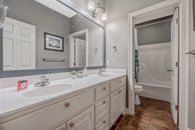 full bathroom featuring tile patterned flooring, vanity, shower / tub combo with curtain, and toilet