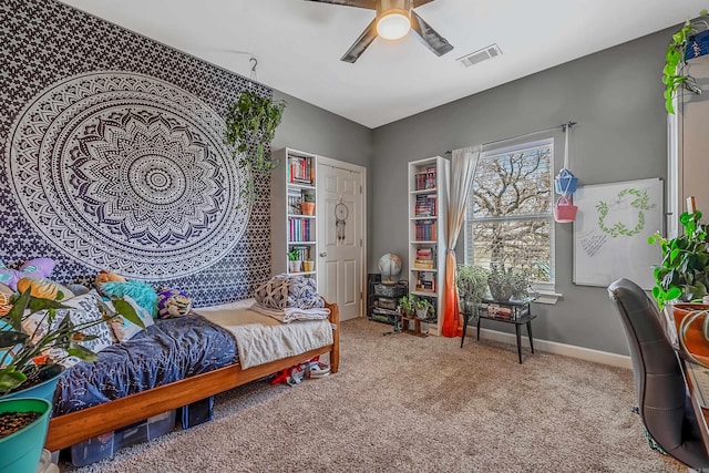 carpeted bedroom with ceiling fan