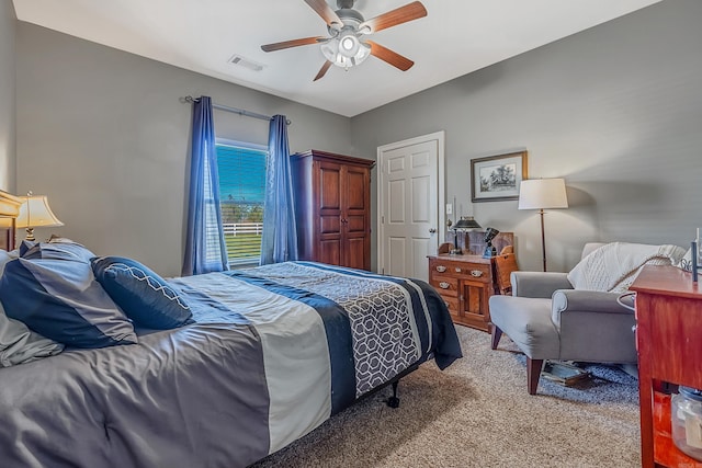 bedroom with light colored carpet and ceiling fan