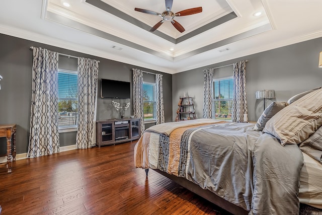 bedroom featuring crown molding, multiple windows, dark wood-type flooring, and ceiling fan