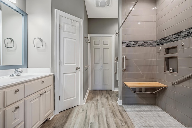 bathroom with vanity and hardwood / wood-style flooring