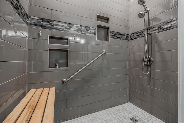 bathroom featuring tiled shower