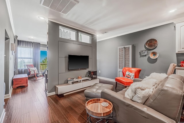 living room featuring dark hardwood / wood-style floors and ornamental molding