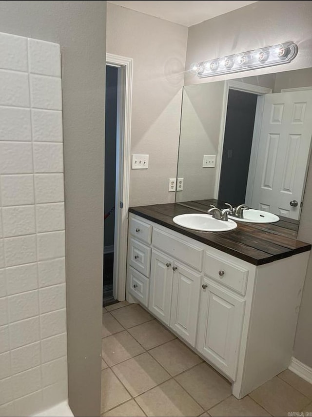 bathroom with vanity and tile patterned floors