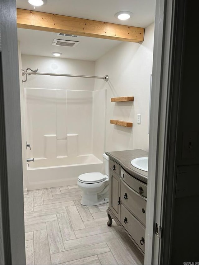 full bathroom with parquet flooring, vanity, shower / bathing tub combination, beamed ceiling, and toilet