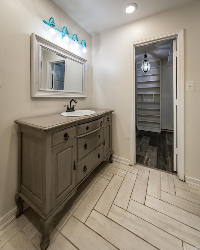 bathroom featuring vanity and wood-type flooring