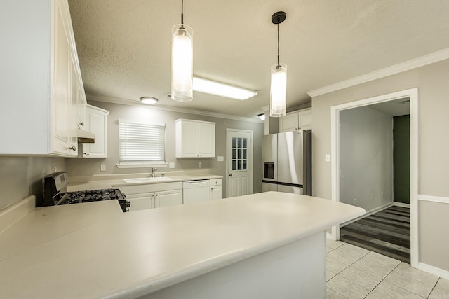 kitchen with kitchen peninsula, white appliances, sink, light hardwood / wood-style flooring, and white cabinets