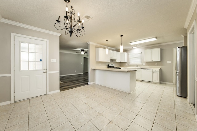 kitchen with kitchen peninsula, white appliances, crown molding, pendant lighting, and white cabinets